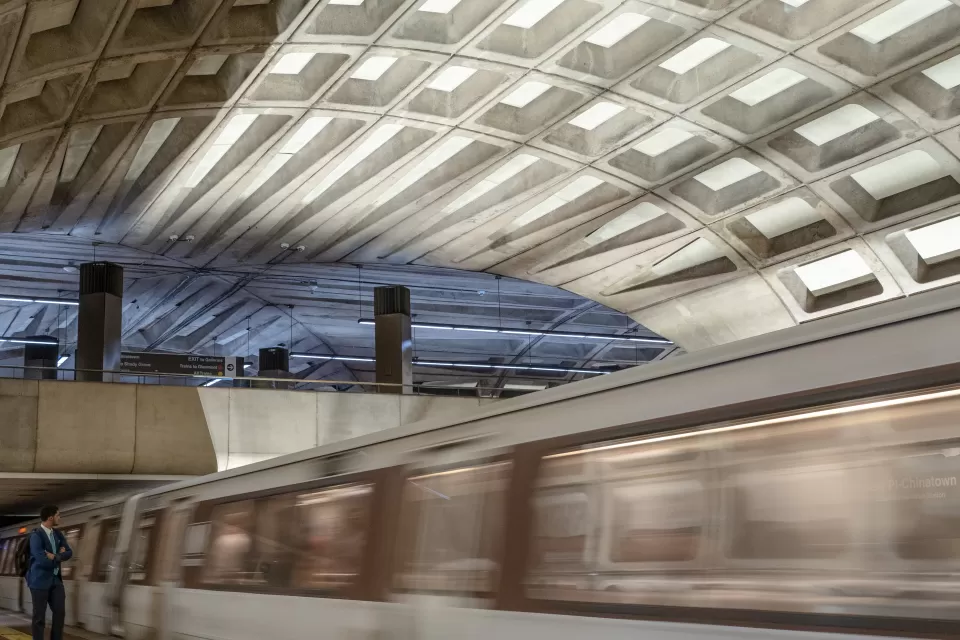 Blurred image of train passing by platform at Washington, D.C. undergroundtrain station